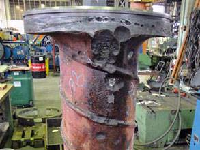 Damaged bow thruster casing of a cargo ship